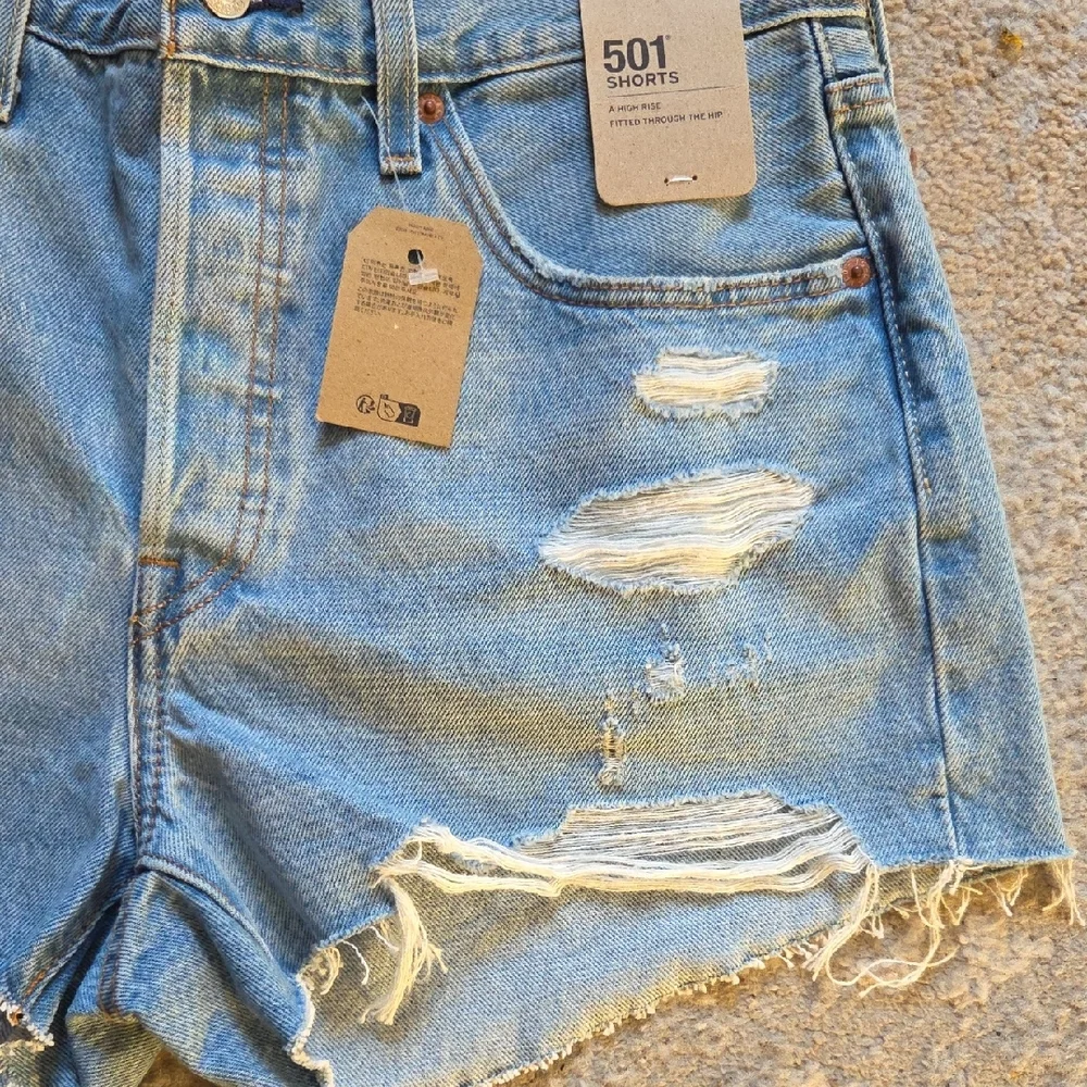 Levi's 501 Light Blue Distressed Jean Shorts‎